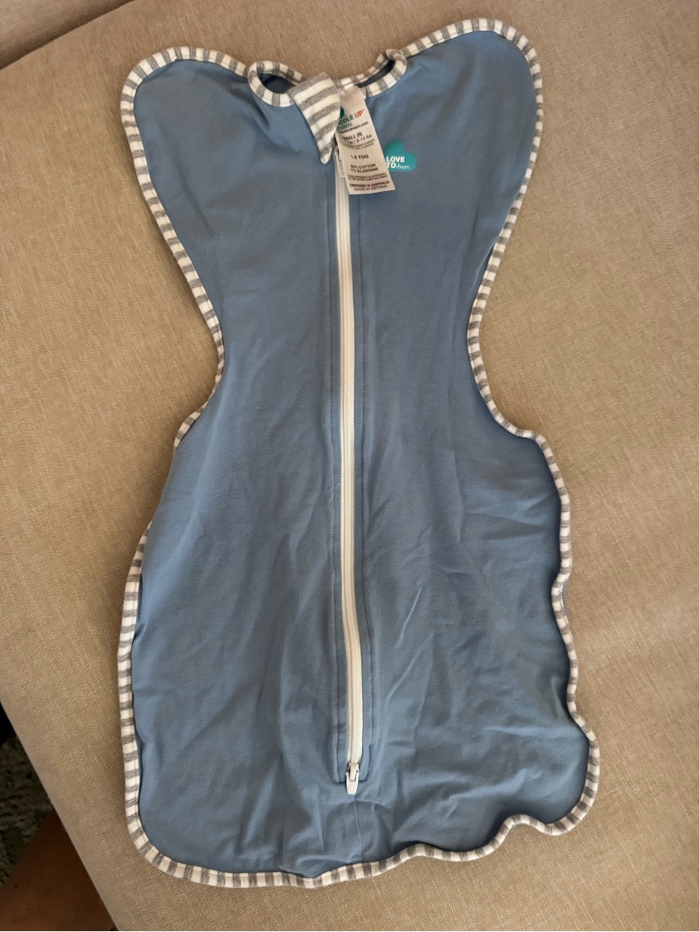 Love to dream blue swaddle with gray striped trim